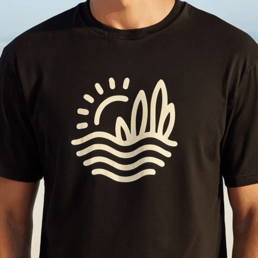 lose-up of abstract waves and sun print on black beach t-shirt" "Detail view of artistic wave design on black cotton beach t-shirt