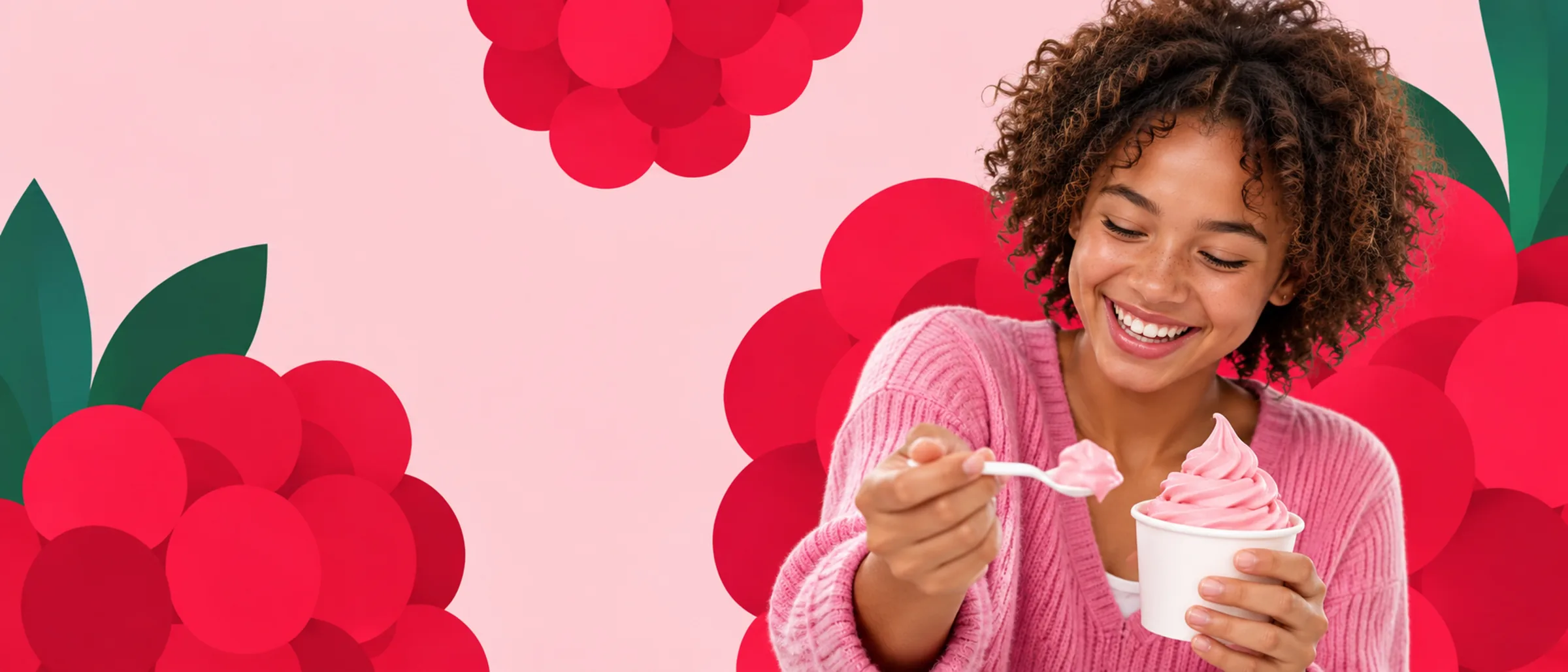 Someone enjoying a cup of Theo’s Raspberry frozen yogurt