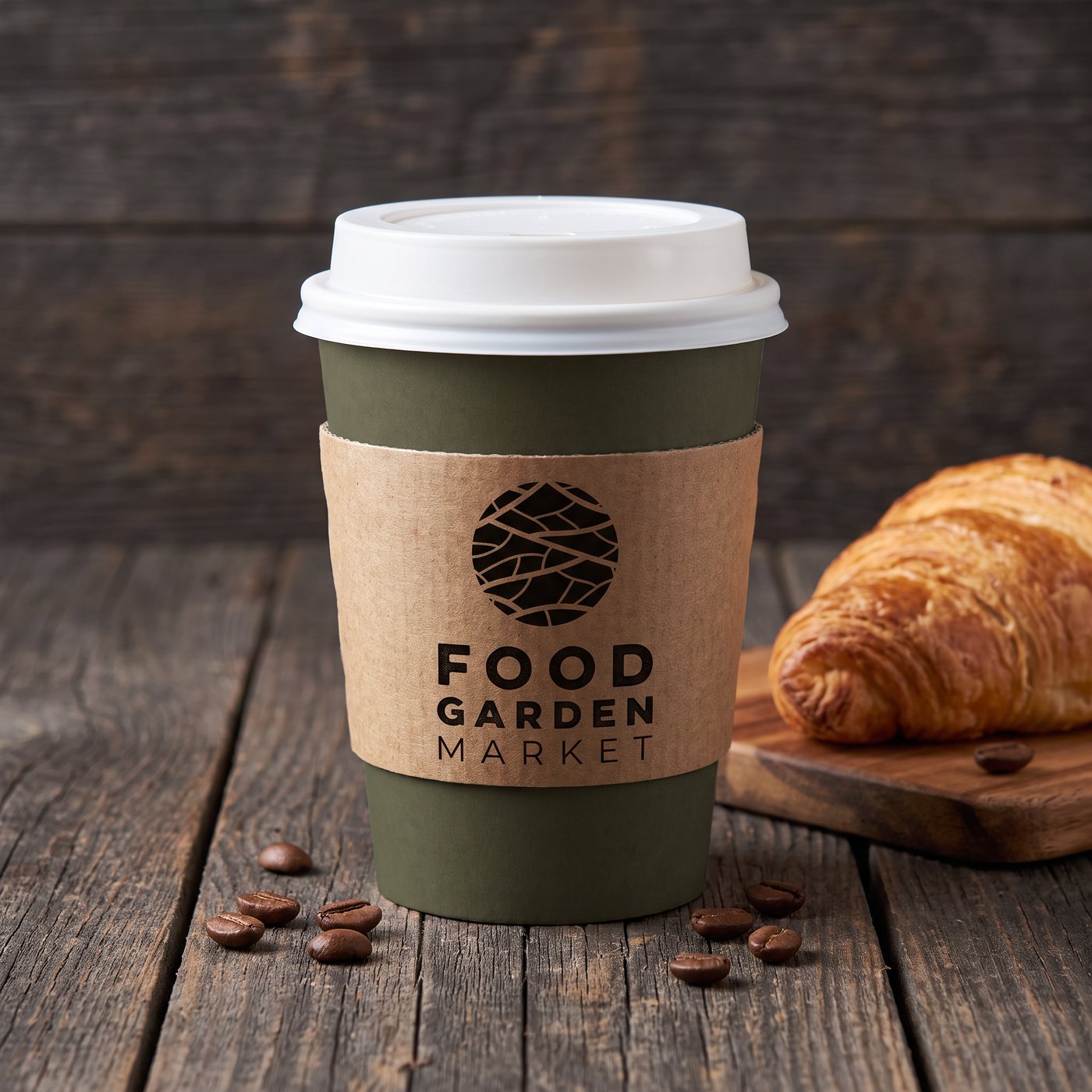 A Food Garden Market takeaway coffee cup with a kraft sleeve and a croissant