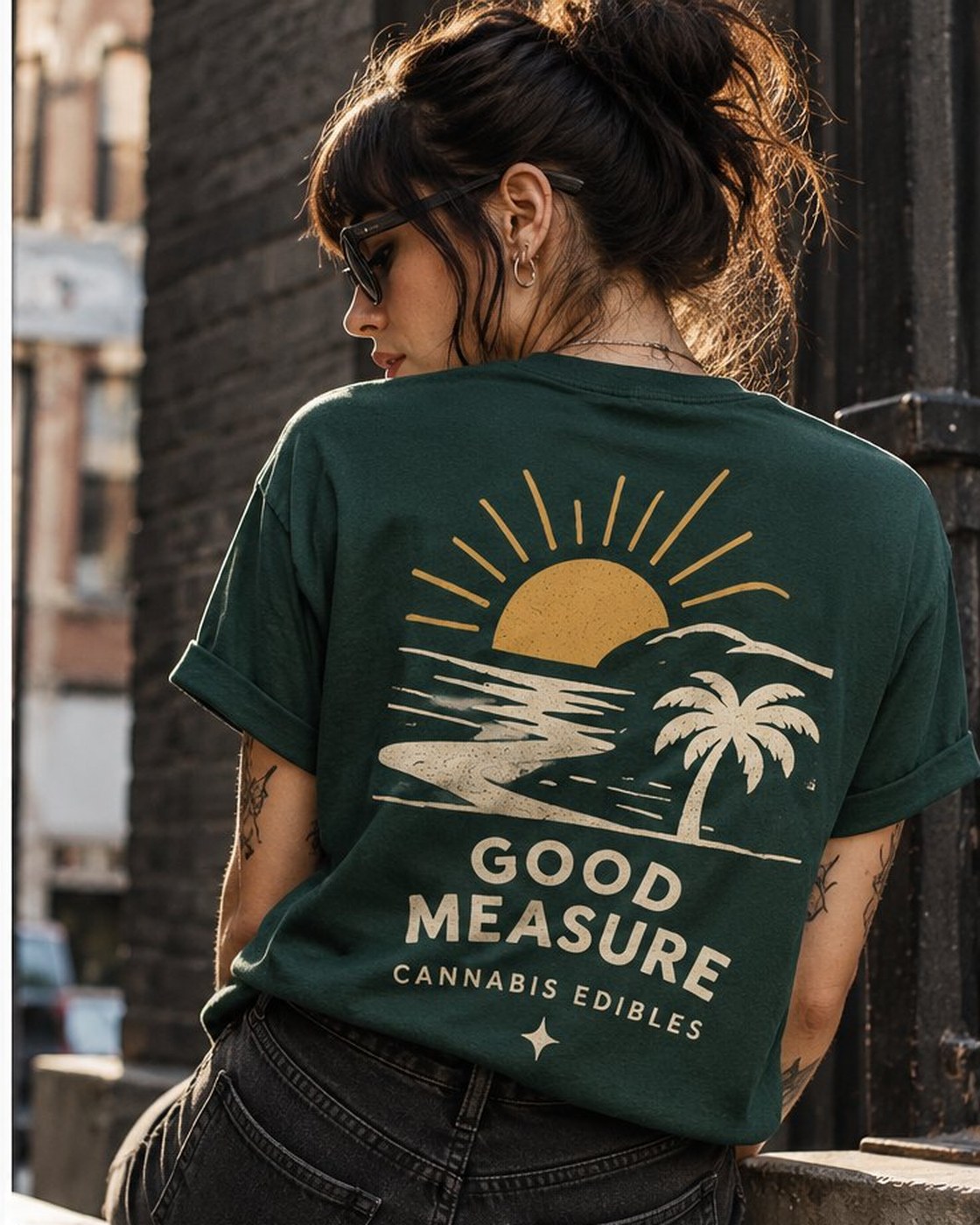 Sun and Palm Tee: Garment-dyed pine cotton: the small badge over the heart, and the sun, the palm and the full name printed large on the back.