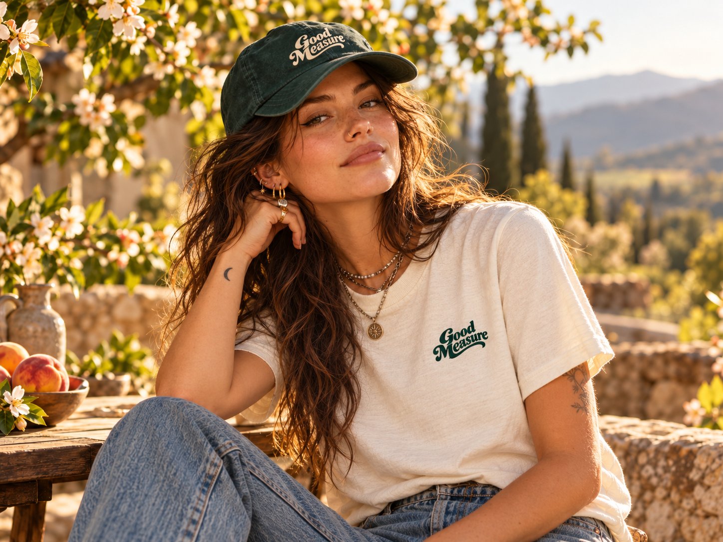The cream tee and pine cap in a peach orchard at golden hour.