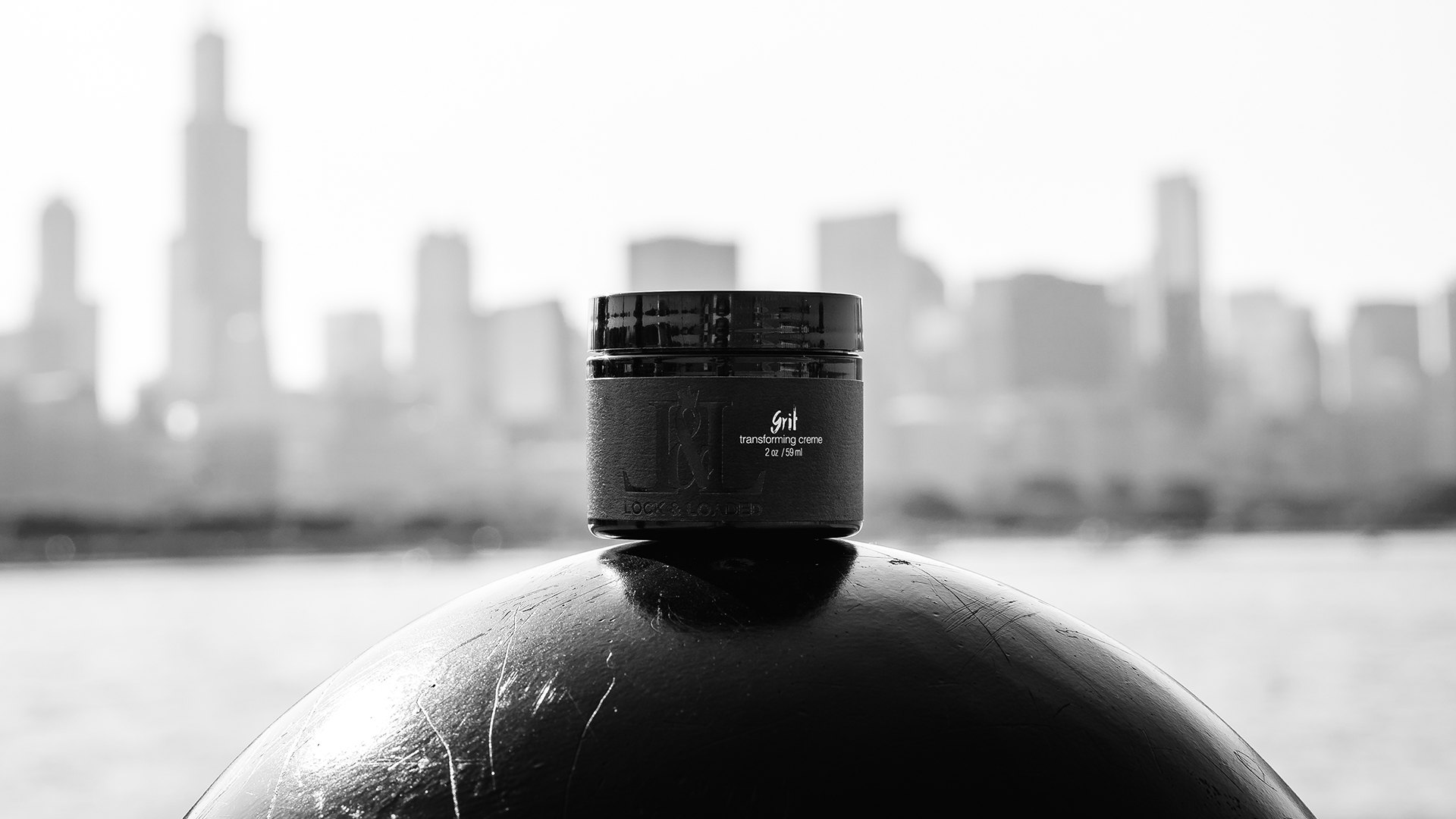 A Grit jar on a bollard facing the Chicago skyline