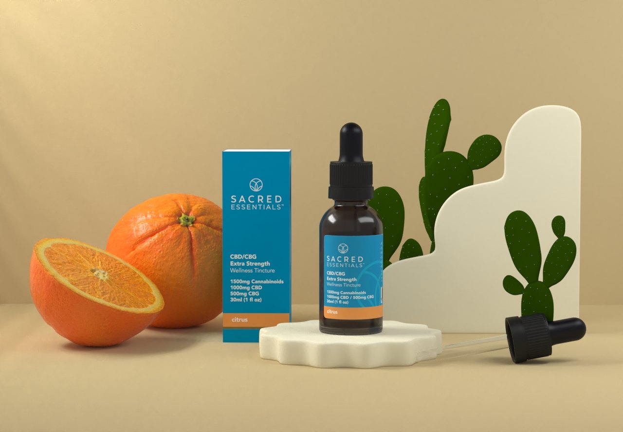 A Sacred Essentials tincture with fresh oranges
