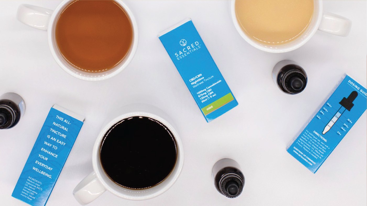 Sacred Essentials tinctures among cups of tea and coffee