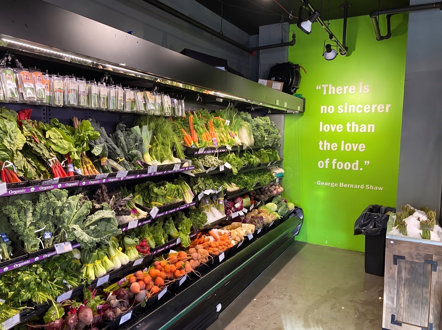 The greens wall with the quote painted on the lime wall beside it